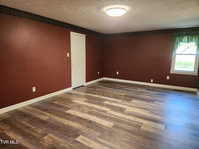 12075 Goose Creek Rd, Bristol, VA 24202 - unfurnished room with a textured ceiling, dark wood finished floors, and baseboards