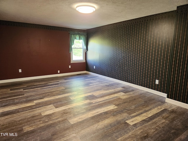 12075 Goose Creek Rd, Bristol, VA 24202 - empty room with wood finished floors, a textured ceiling, and baseboards