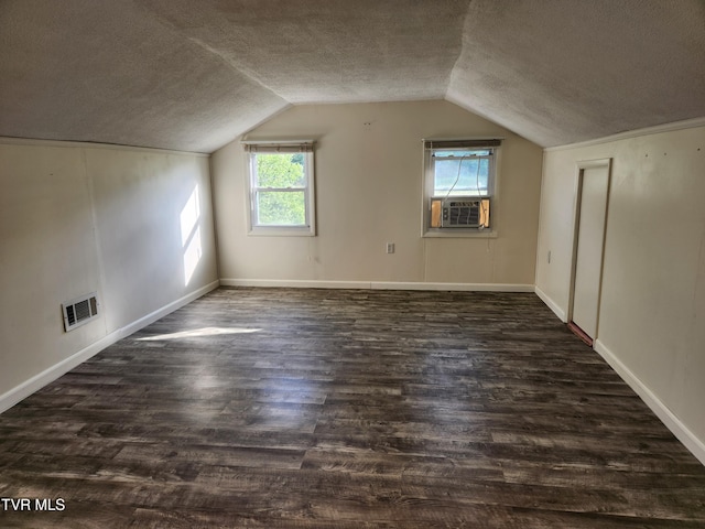 12075 Goose Creek Rd, Bristol, VA 24202 - bonus room featuring a textured ceiling, vaulted ceiling, cooling unit, dark wood-style flooring, and baseboards