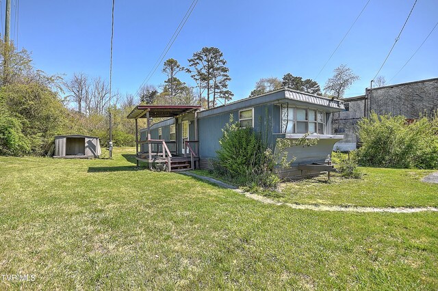 4418 Weaver Pike, Bluff City, TN 37618 - exterior space with an outdoor structure, a lawn, and a shed
