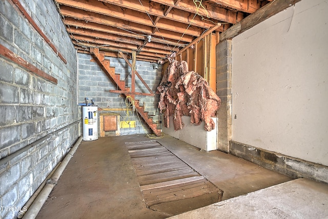 4418 Weaver Pike, Bluff City, TN 37618 - unfinished basement featuring water heater, concrete block wall, and stairway