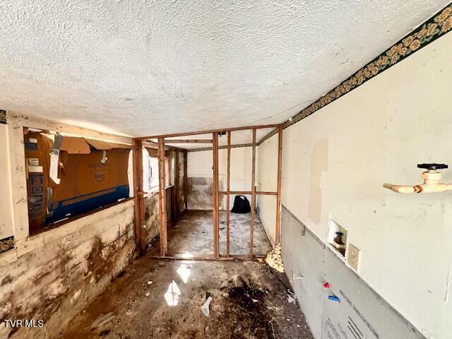 interior space with a textured ceiling