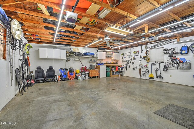 344 Virginia Dr, Bristol, VA 24201 - garage featuring a workshop area and a garage door opener