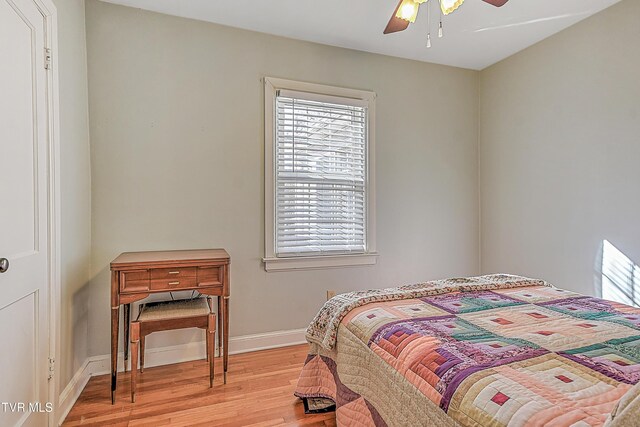 344 Virginia Dr, Bristol, VA 24201 - bedroom with light wood finished floors, a ceiling fan, and baseboards