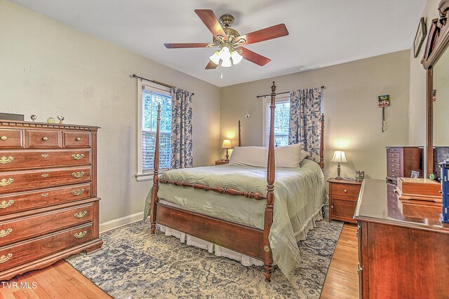 344 Virginia Dr, Bristol, VA 24201 - bedroom with light wood-type flooring, a ceiling fan, and baseboards