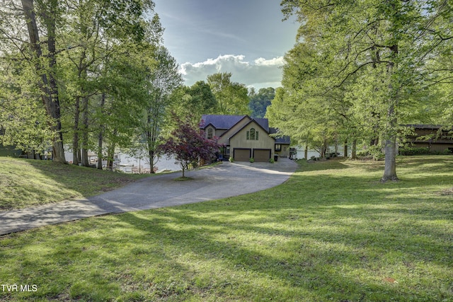 768 Lake Point Dr, Piney Flats, TN 37686 - view of front of home with an attached garage, a front yard, and driveway