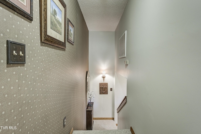 768 Lake Point Dr, Piney Flats, TN 37686 - staircase featuring a textured ceiling, carpet flooring, baseboards, and visible vents