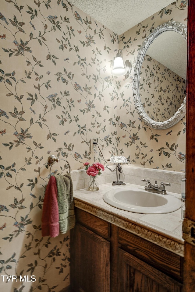 768 Lake Point Dr, Piney Flats, TN 37686 - bathroom featuring wallpapered walls, a textured ceiling, and vanity