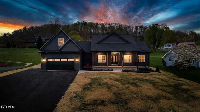 330 Bogey Dr, Abingdon, VA 24211 - view of front of house with a yard, board and batten siding, driveway, a porch, and a garage