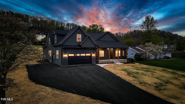 330 Bogey Dr, Abingdon, VA 24211 - view of front of property featuring a front lawn, driveway, board and batten siding, covered porch, and a garage