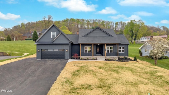 330 Bogey Dr, Abingdon, VA 24211 - view of front of house with a front lawn, driveway, covered porch, a shingled roof, and board and batten siding