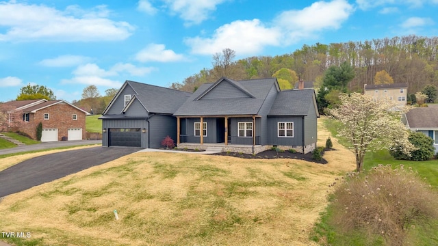 330 Bogey Dr, Abingdon, VA 24211 - view of front of home with a garage, driveway, a front lawn, and covered porch