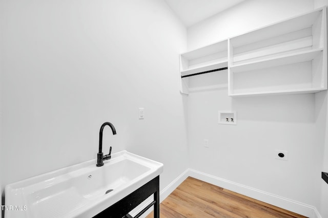 330 Bogey Dr, Abingdon, VA 24211 - washroom featuring light wood finished floors, a sink, hookup for a washing machine, electric dryer hookup, and laundry area