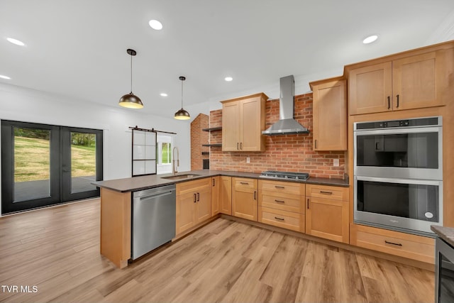 330 Bogey Dr, Abingdon, VA 24211 - kitchen with stainless steel appliances, dark countertops, wall chimney range hood, a sink, and a peninsula