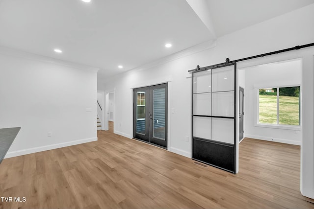 330 Bogey Dr, Abingdon, VA 24211 - unfurnished room featuring a barn door, crown molding, stairs, light wood finished floors, and baseboards