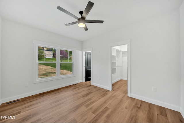 330 Bogey Dr, Abingdon, VA 24211 - unfurnished bedroom with baseboards, visible vents, a spacious closet, light wood-style floors, and a closet