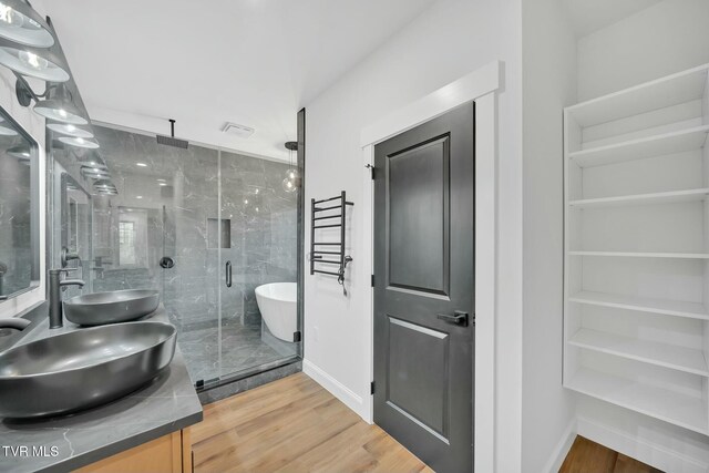 330 Bogey Dr, Abingdon, VA 24211 - full bathroom with baseboards, wood finished floors, a sink, and a shower stall