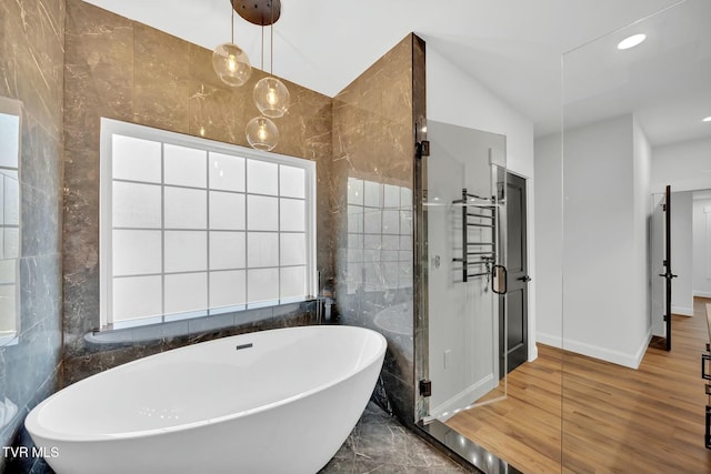 330 Bogey Dr, Abingdon, VA 24211 - full bath with tile walls, a freestanding tub, baseboards, and wood finished floors