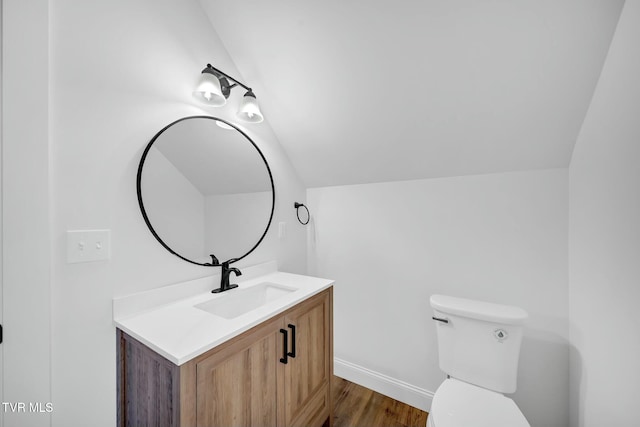 330 Bogey Dr, Abingdon, VA 24211 - bathroom featuring toilet, vaulted ceiling, baseboards, wood finished floors, and vanity