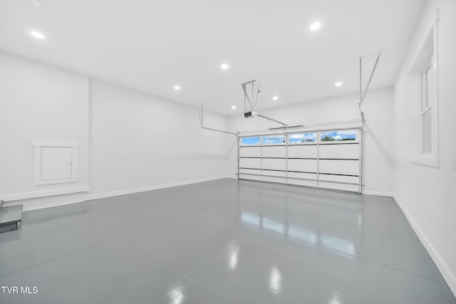 330 Bogey Dr, Abingdon, VA 24211 - garage featuring baseboards, recessed lighting, and a garage door opener