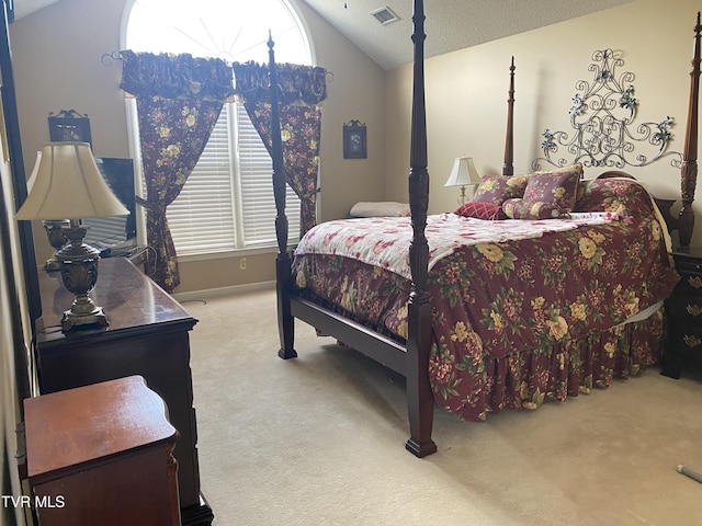 bedroom with carpet floors, vaulted ceiling, visible vents, and baseboards
