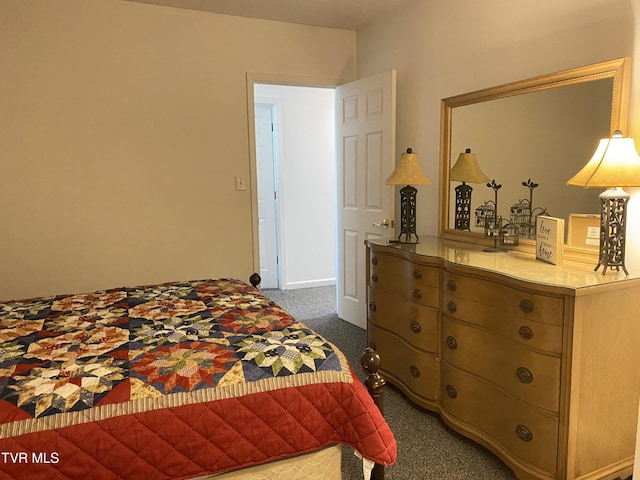 bedroom with dark carpet