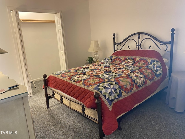 bedroom featuring baseboards and carpet flooring