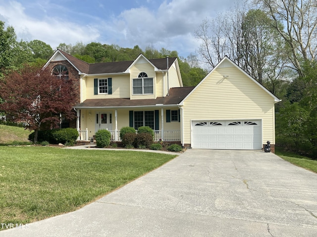 traditional home with a porch, a front lawn, driveway, and a garage