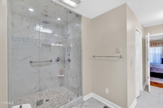 ensuite bathroom featuring a marble finish shower, marble finish floor, baseboards, ensuite bath, and visible vents
