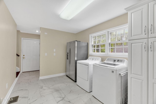 laundry room featuring cabinet space, marble finish floor, baseboards, and recessed lighting