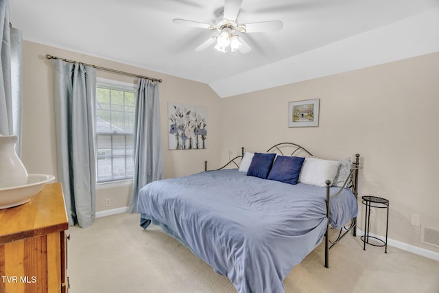 bedroom featuring vaulted ceiling, carpet floors, baseboards, and ceiling fan