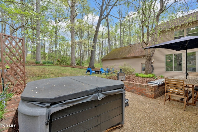 exterior space featuring a hot tub