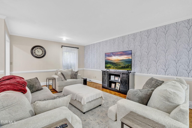 living area with wallpapered walls, wood finished floors, baseboards, and crown molding