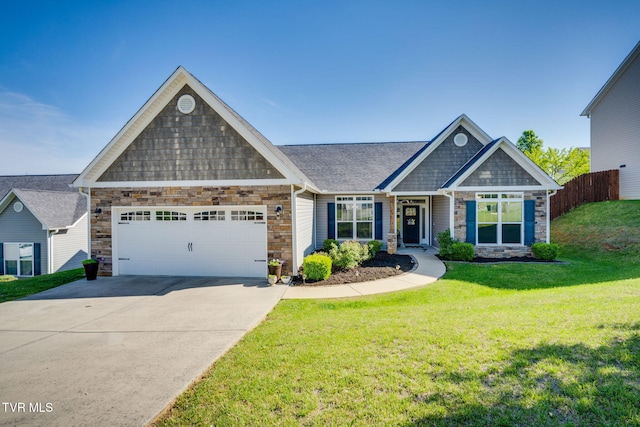 craftsman-style home featuring a front lawn, driveway, stone siding, an attached garage, and fence