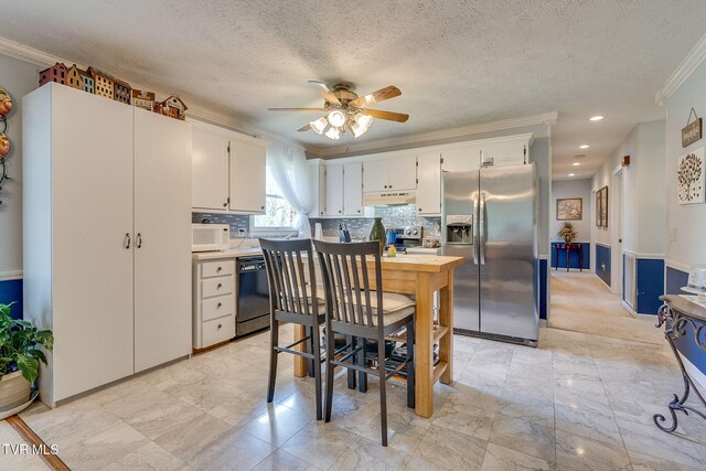 kitchen with dishwasher, a ceiling fan, crown molding, white microwave, and stainless steel fridge