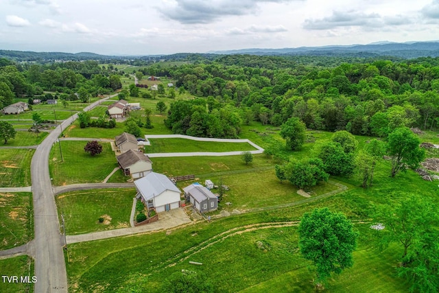 drone / aerial view with a rural view and a forest view