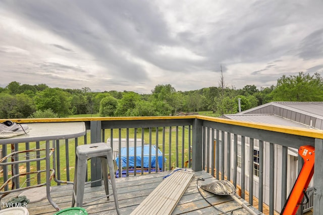 wooden deck with a yard