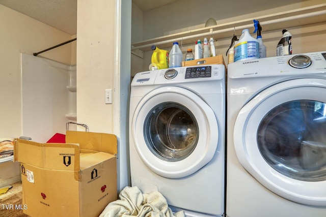 washroom with laundry area and washing machine and dryer