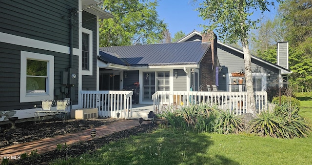 304 Tunnel Dr, Dryden, VA 24243 - exterior space featuring a chimney, a wooden deck, and a yard