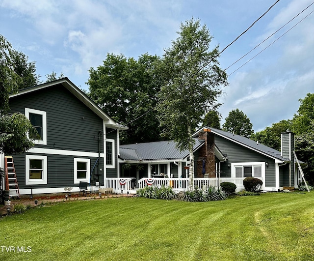 304 Tunnel Dr, Dryden, VA 24243 - back of house with a lawn and a chimney