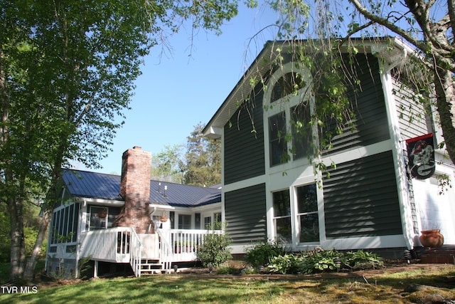 304 Tunnel Dr, Dryden, VA 24243 - rear view of property featuring metal roof, a standing seam roof, a wooden deck, and a chimney
