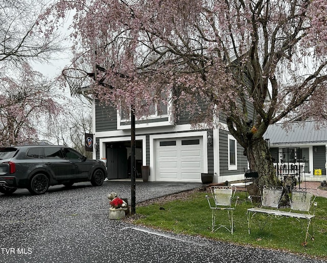 304 Tunnel Dr, Dryden, VA 24243 - view of home's exterior with aphalt driveway and an attached garage