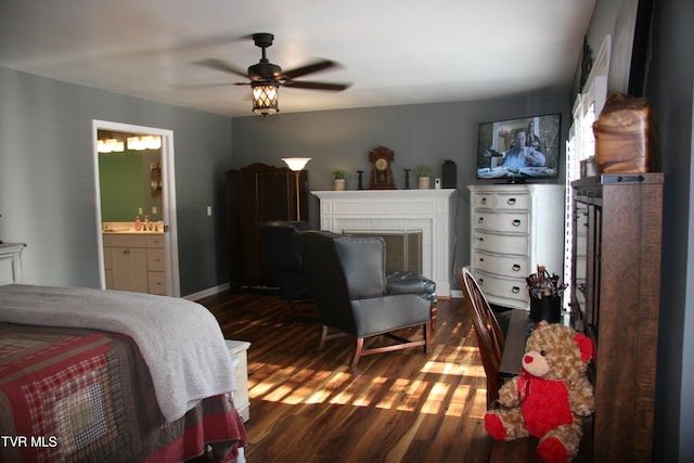 304 Tunnel Dr, Dryden, VA 24243 - bedroom featuring a fireplace, dark wood-style flooring, ensuite bath, and baseboards
