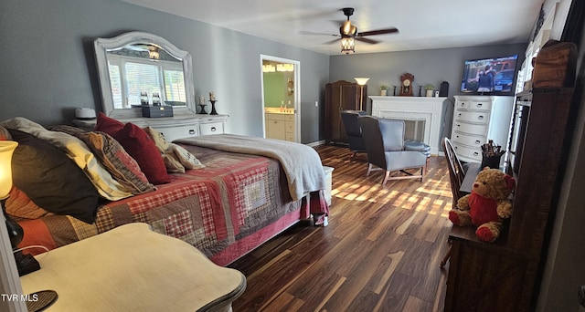 304 Tunnel Dr, Dryden, VA 24243 - bedroom featuring wood finished floors, ceiling fan, ensuite bath, and a fireplace