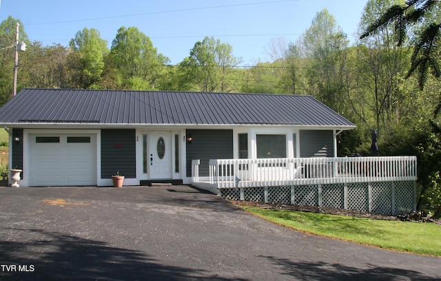 304 Tunnel Dr, Dryden, VA 24243 - view of front facade featuring covered porch, driveway, metal roof, and an attached garage