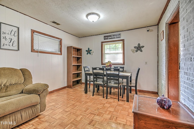 2856 Watauga Rd, Johnson City, TN 37601 - dining area with baseboards, a textured ceiling, and visible vents