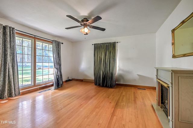 2856 Watauga Rd, Johnson City, TN 37601 - unfurnished living room featuring baseboards, a fireplace, and a healthy amount of sunlight