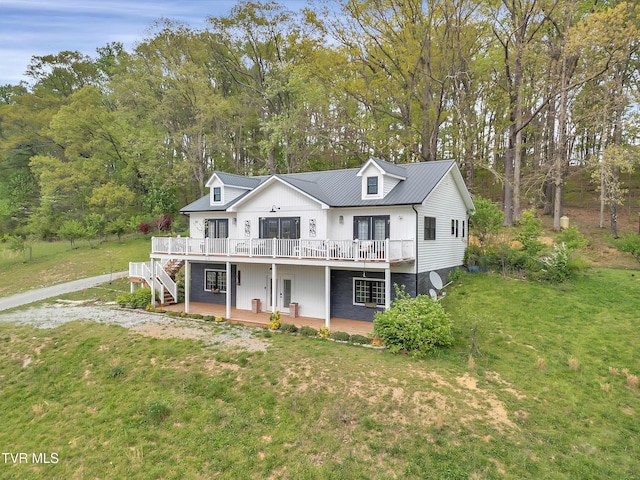 2040 Happy Valley Rd, Limestone, TN 37681 - view of front facade featuring french doors, metal roof, a front yard, a deck, and stairway