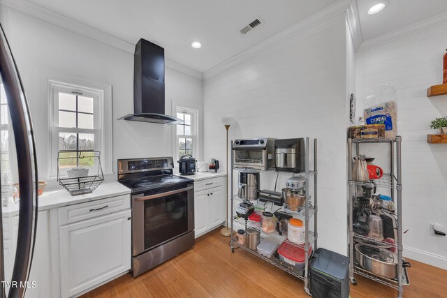 2040 Happy Valley Rd, Limestone, TN 37681 - kitchen featuring crown molding, appliances with stainless steel finishes, range hood, and visible vents