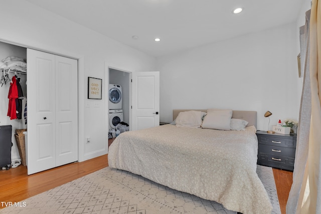 2040 Happy Valley Rd, Limestone, TN 37681 - bedroom featuring stacked washing maching and dryer, recessed lighting, a closet, and light wood-type flooring